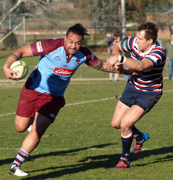 Wests Fotu Auelua evades Easts Andrew Smith Competitors here! Team mates for UC Vikings!