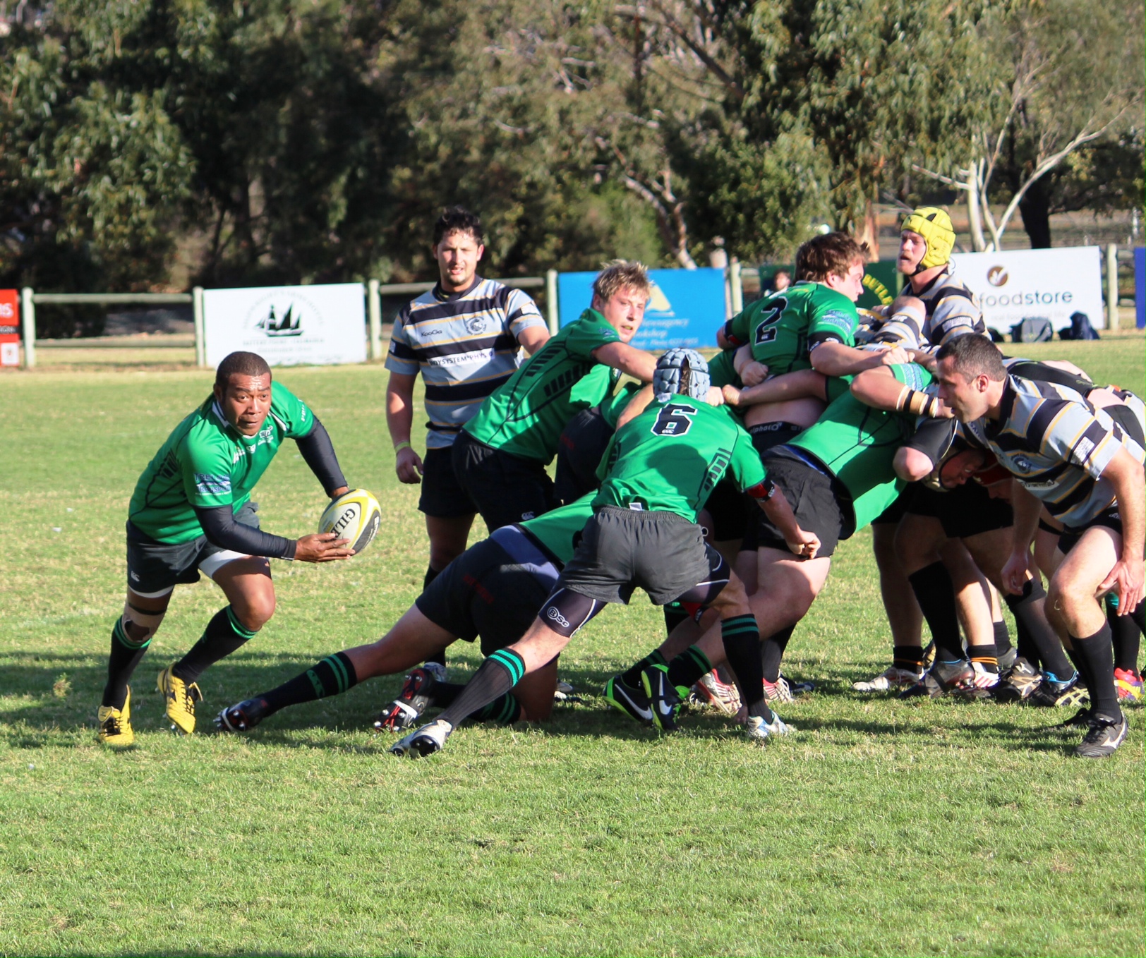 Devonport Bulls Number 8 Bruce Lasaganibau confronts the Hobart Lions skipper Adam Johnston