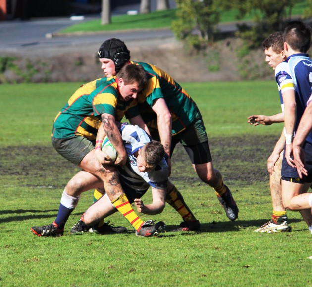 Tasmanian Under 18 defenders Oscar Beattie and Eugene Smith secure the ball against Victorian Schools