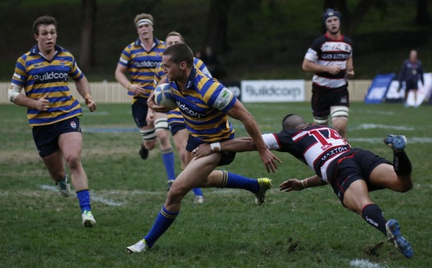 Chris Ingate clears the last hurdle in a run to the try line