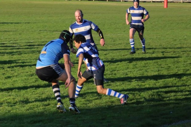 Taroona's Leroy Hart attempts to sidestep through the AMC defence - Photo Credit CMW Photography