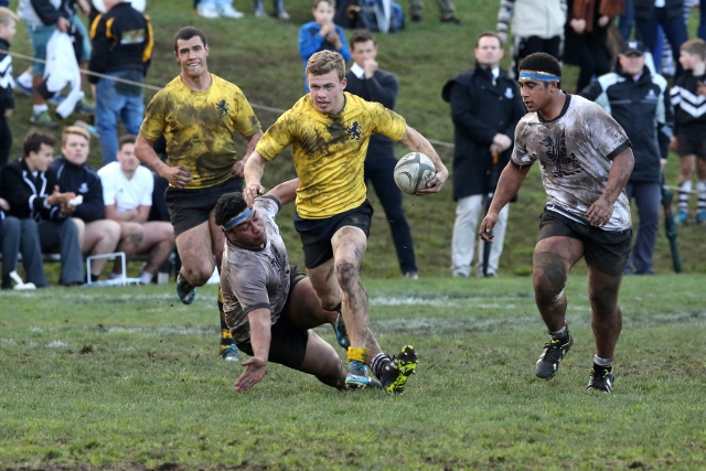 Theo Strang sprints through the big boppers to score a try 