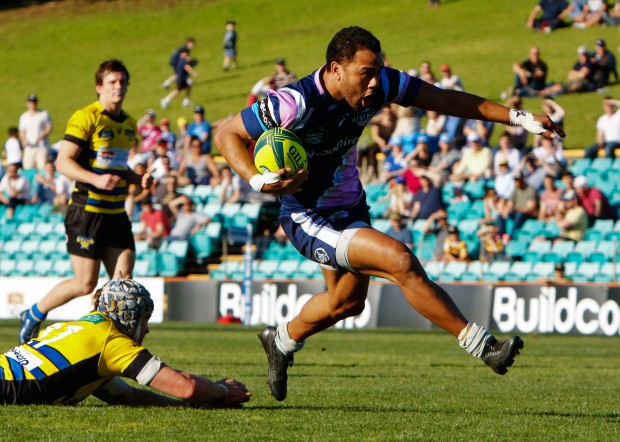 Melbourne Risings winger Talusa Veainu strides for the try line - Karen Watson Photography