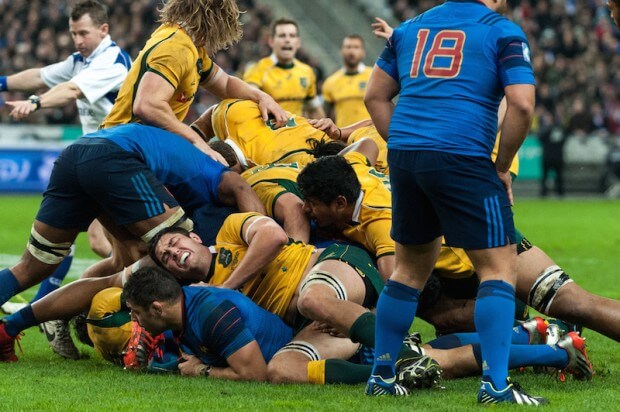 Australian lock, Rob Simmons, grimaces in pain as his team mates secure the ruck.