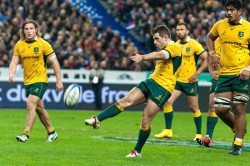 Australian flyhalf, Bernard Foley, kicking for touch following a pentaly against the French.