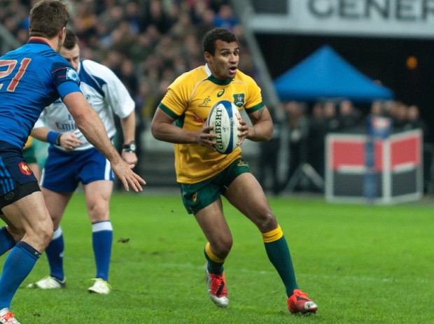 Will Genia, replacement Wallabies' half back, runs toward the line before deciding to pass.