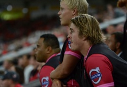 Sam Greene and Andrew Ready watch on from the bench.