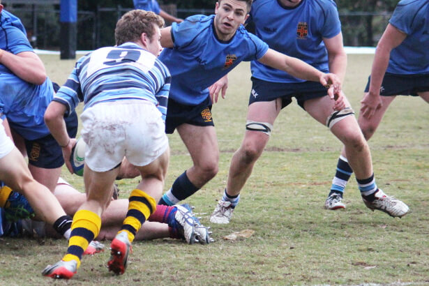 Theo Strang clears the ruck