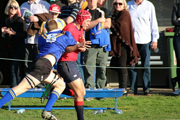 Waves Justin Cooper in cover defence before being injured. 