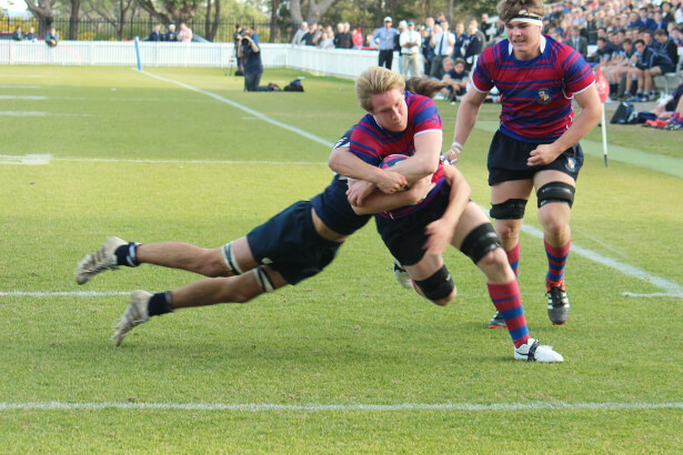 Dom McGrath - about to score in the tackle of Ben Kennedy