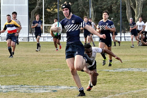 Harry Cudmore eludes Sepasa Loga-Tarogi and will score