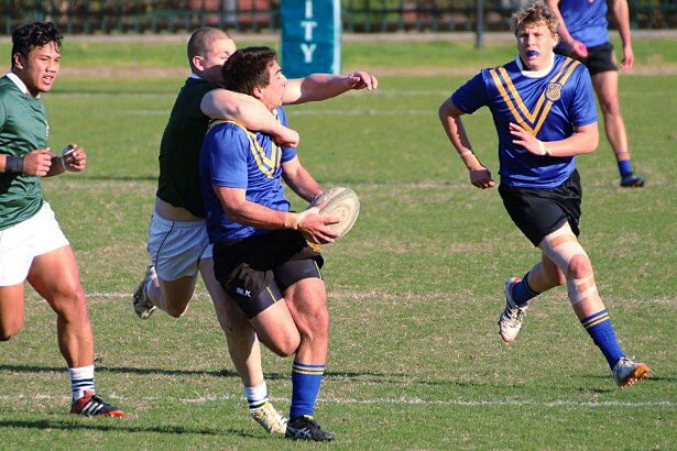 Harry McLennan tackles Stefan Kovacevic