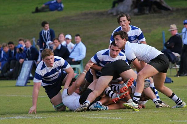 Matthew Long clears ball for Newington