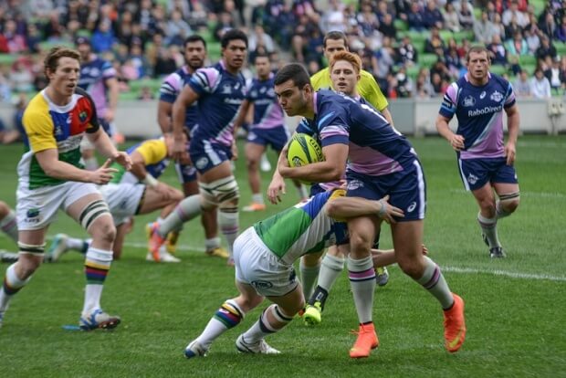 Melbourne Rising Jack Debreczeni breaks a tackle