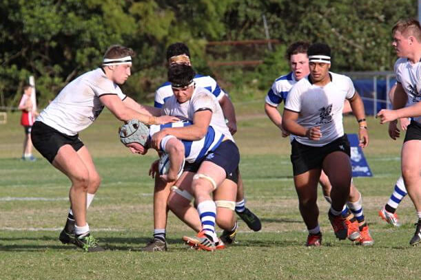 Xavier Fitzpatrick and large Newington tacklers