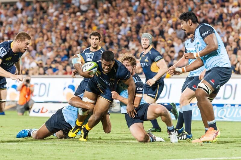 Scott Sio showing his leg strength as he is tackled by Michael Hooper.