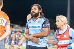 Waratahs' hooker, Tatafu Poloya-Nau leaves the field with an injured arm.