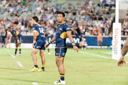Christian Lealiifano passes the word out along the line about field placement.