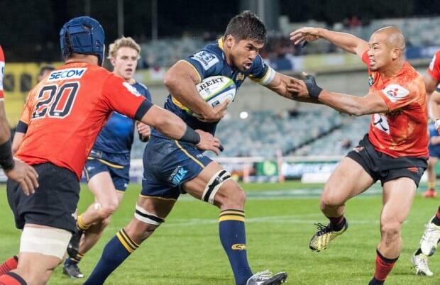 Jarrad Butler pushes off the Sunwolves' scrum half, Yuki Yatomi.