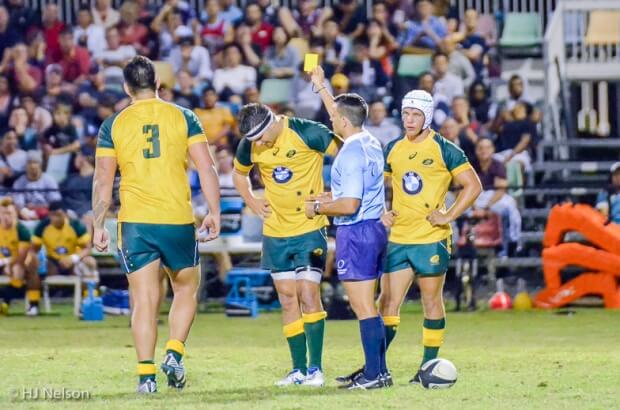 Tyrel Lomax (3) receives a yellow card, much to Maclean Jones' dismay