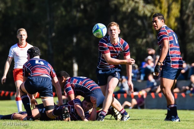 TSS half-back Ted Stuart clears the ball