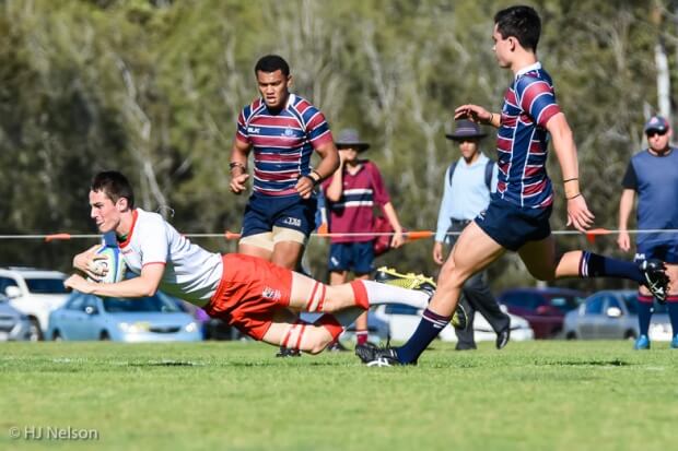 Noah Hughes (6) scores IGS's first try
