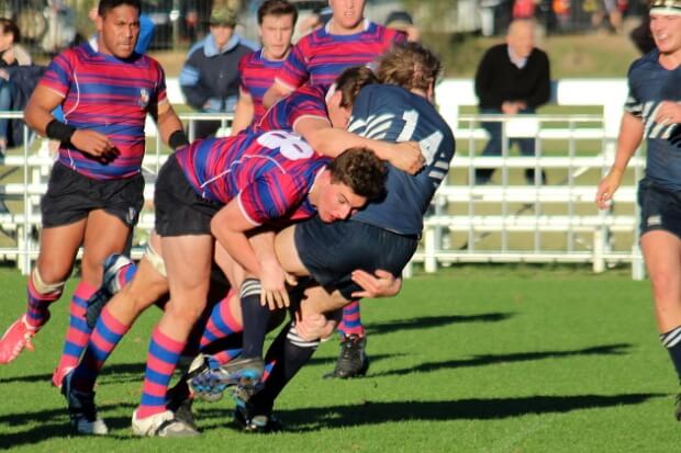 Winger Fynn Baveystock sandwiched by Joe boys