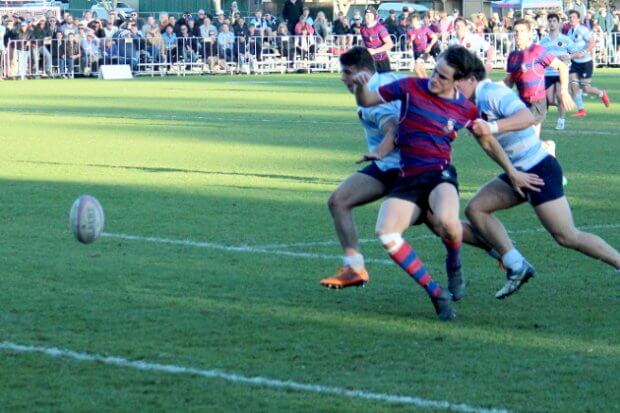 Matthew McTaggart (centre) attempting to score his second try