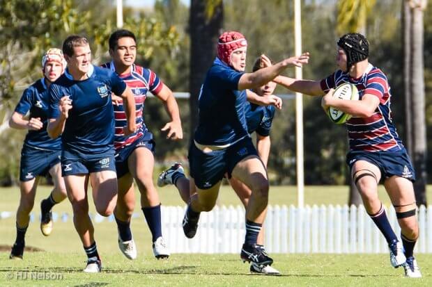 Jack Butler of TSS prepares to fend Fraser McReight of BGS