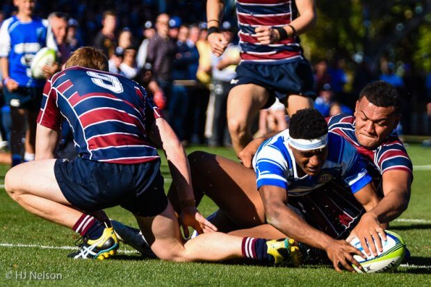 Willie Malala scores his second try despite the efforts of Tipene Mavoa