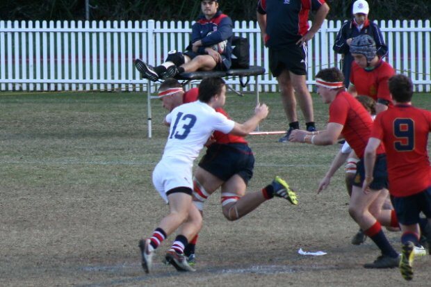 Harry Flaherty (Barker) tackled by Mitch Dickins