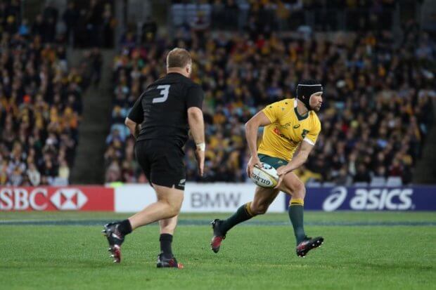 Matt Giteau shapes to pass.