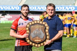 Tim Horan presents the Horan-Little Shield to UC Vikings captain Robbie Colman