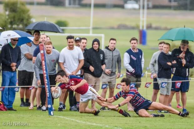 Max Dowd manages to get Neal McNamara into touch 