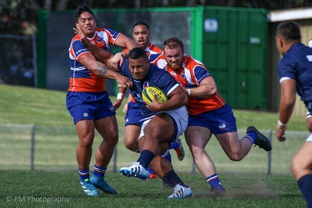 Taniela Tupou takes some tackling.