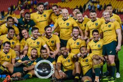 Wallabies players posing with the Nelson Mandela Challenge Plate