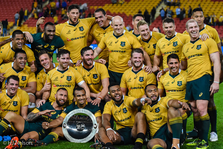 Wallabies players posing with the Nelson Mandela Challenge Plate