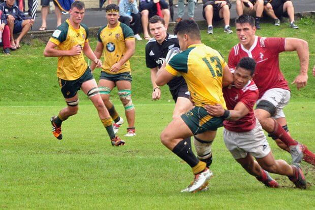 Hunter Paisami gets nabbed but he scored a try to give the Aussies a chance