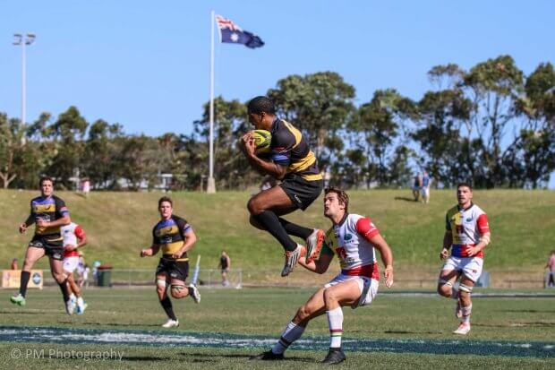 Marcel Brache catches while Harry Jones waits.