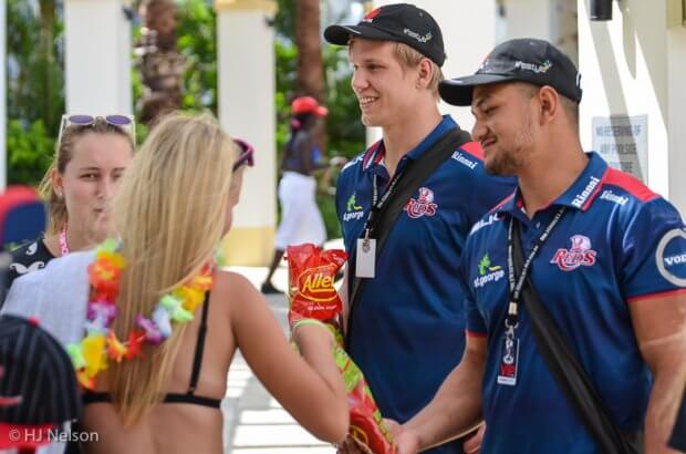 Adam Korzyk and Henry Taefu hand out Red Frogs to Gold Coast Schoolies