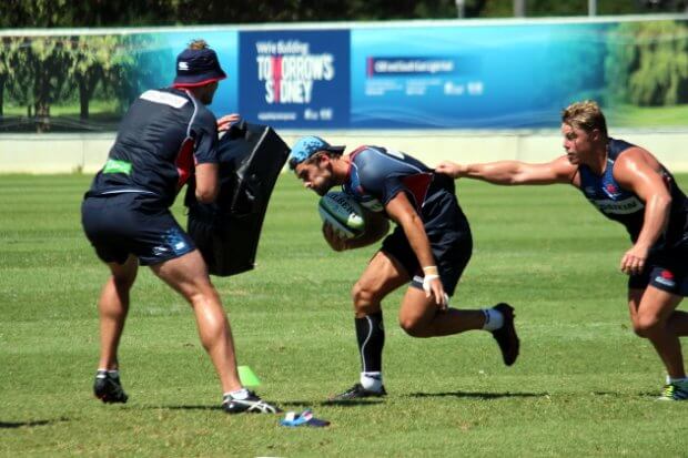 Hugh Roach latches onto Harry Jones