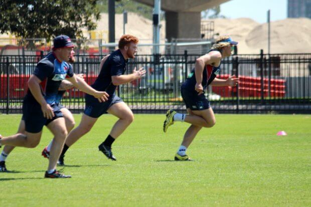 O'Connor, Johnson-Holmes and Hanigan chase a kick-off