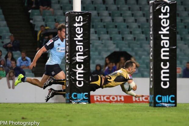 Jono Lance dives over for his first half try.