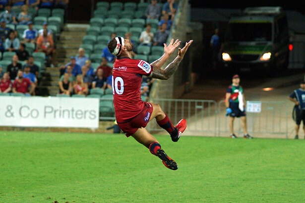 Quade Cooper takes the ball