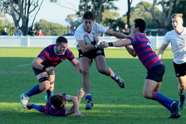 Dan Garing evades a few tacklers