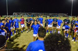 Fiji and Samoa players share a moment after their game