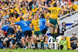 Italian half-back Edoardo Gori launches Jack Dempsey into the second row of the stands