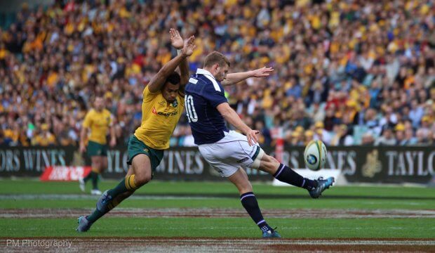 Finn Russell gets a kick off.