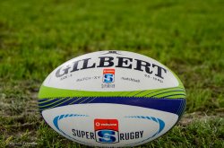 Stock Photo. Gilbert Super Rugby ball on grass. 