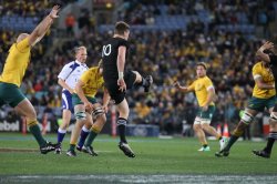 Beauden Barrett kicks clear.